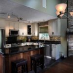White L-Shaped Kitchen with dark maple island