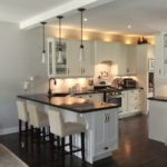 White kitchen with peninsula.  The drawer on the end cap hides doggy dishes.