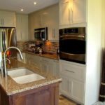 Two-tone kitchen with dark-stained maple island