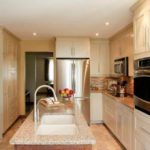 Two-tone kitchen with dark-stained maple island